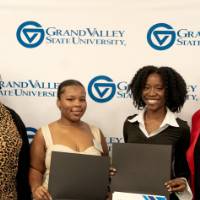 Group of women posing with awards